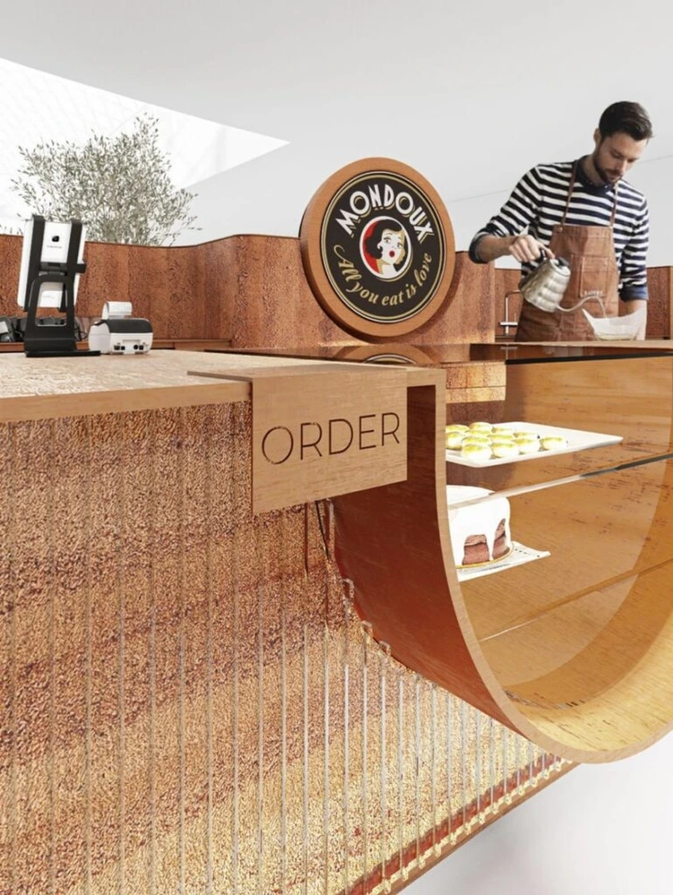 باريستا يقدّم الخدمة للضيوف في كشك Mondieu Specialty Coffee في يوروفيا، براتيسلافا